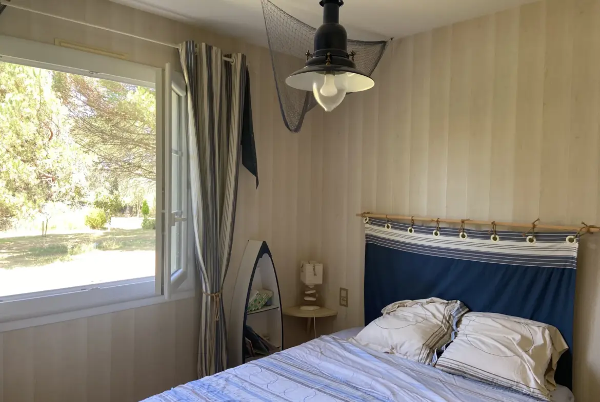 Maison de plain-pied avec piscine et garage à Castelnau d'Auzan-Labarrère 