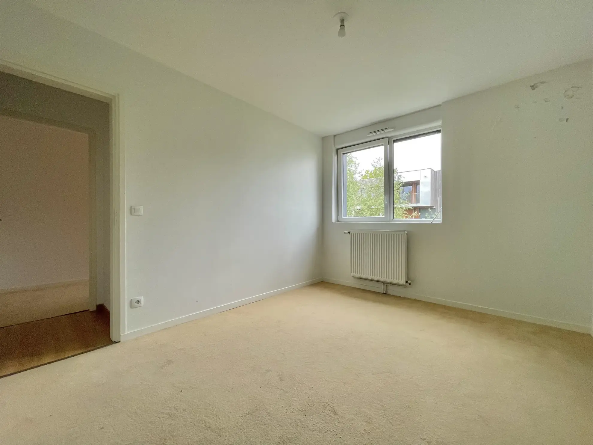 Appartement T4 à Lille Moulins avec balcons et place de parking 