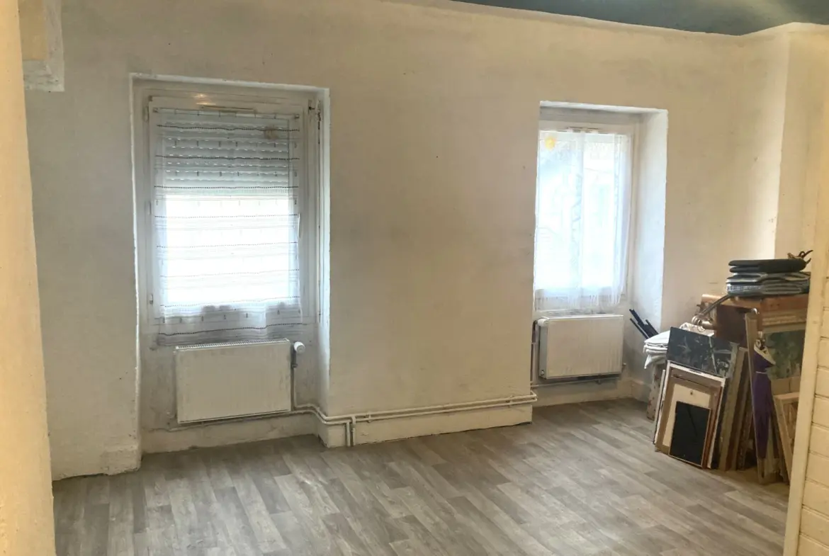 Vente maison de ville à Tenay - 118 m² sur 5 niveaux avec garage et jardin 