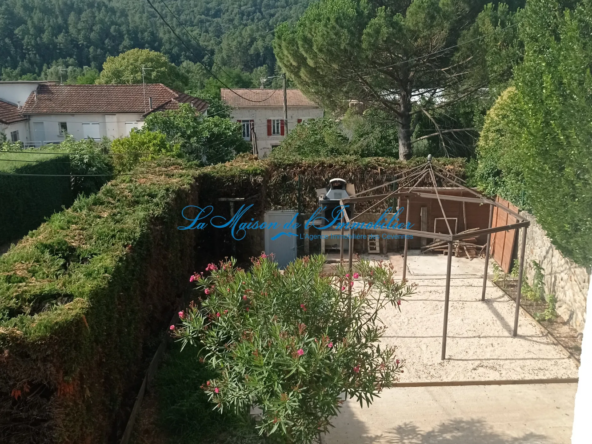 Maison de village en pierres avec jardin à St Florent sur Auzonnet 