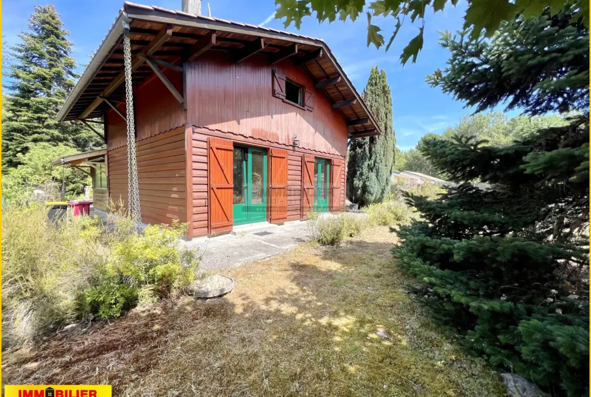 Maison en bois type chalet avec garage à Saint-Michel de Rieufret 