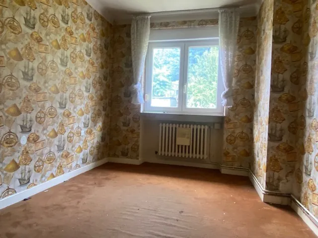 Appartement à vendre à Algrange – 4 chambres, jardin, garage, potentiel à saisir 