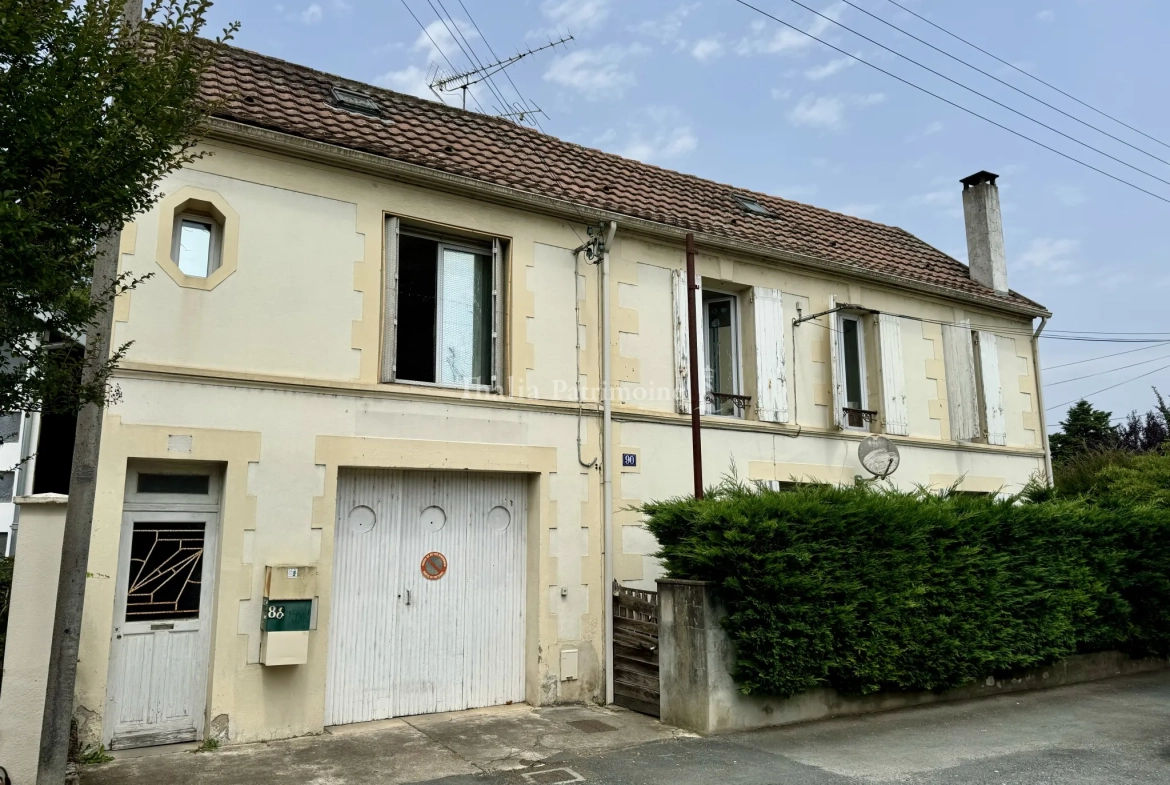 Immeuble de rapport à vendre à Bergerac avec parking et grand jardin 