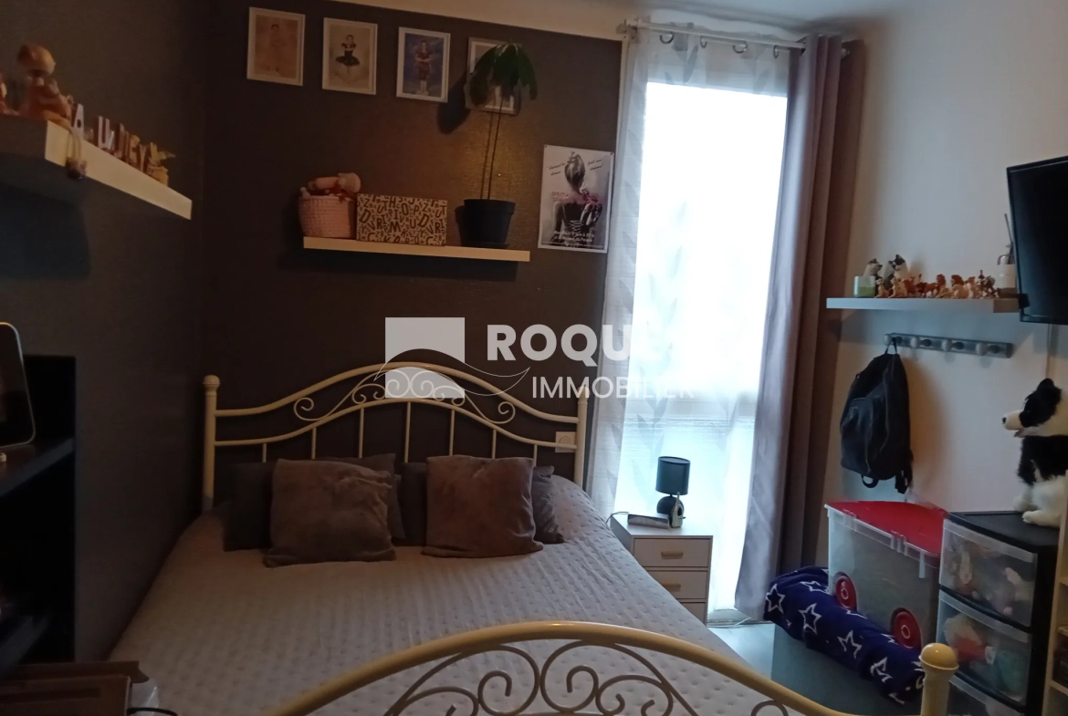 Bel appartement T4 à Millau avec balcon, cave et parking, proche des berges du Tarn 