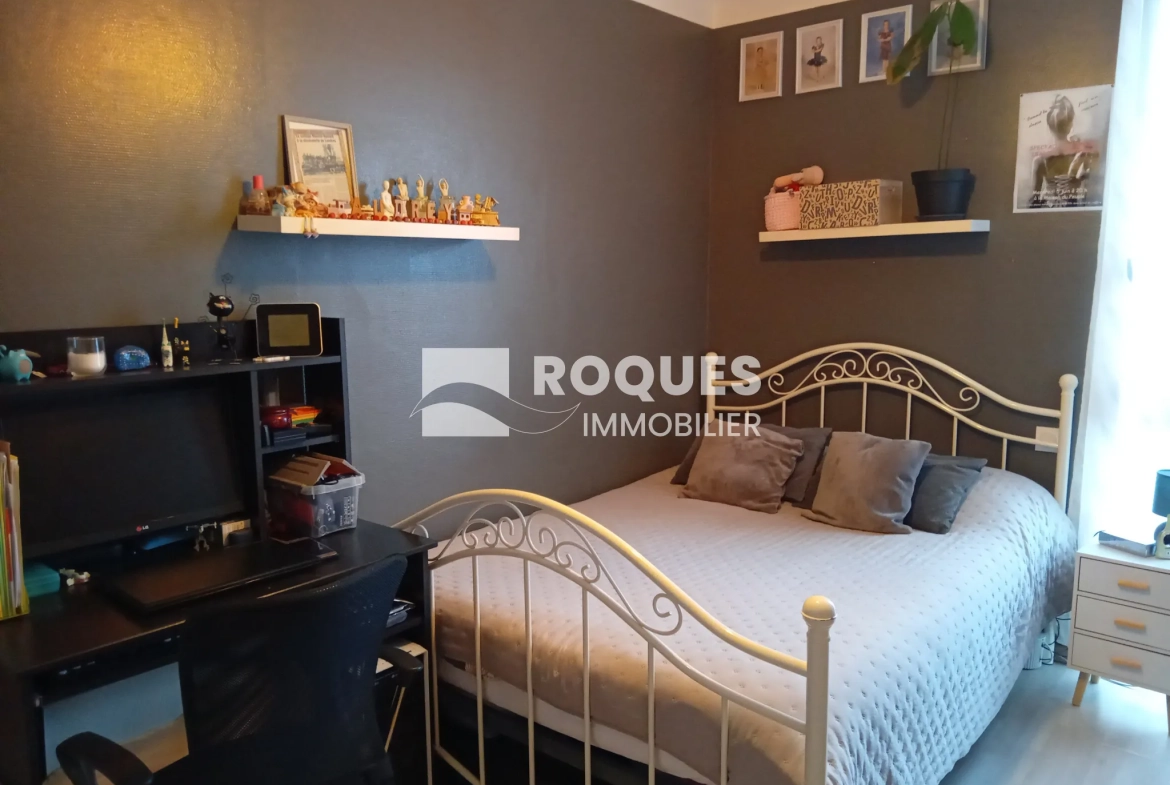 Bel appartement T4 à Millau avec balcon, cave et parking, proche des berges du Tarn 