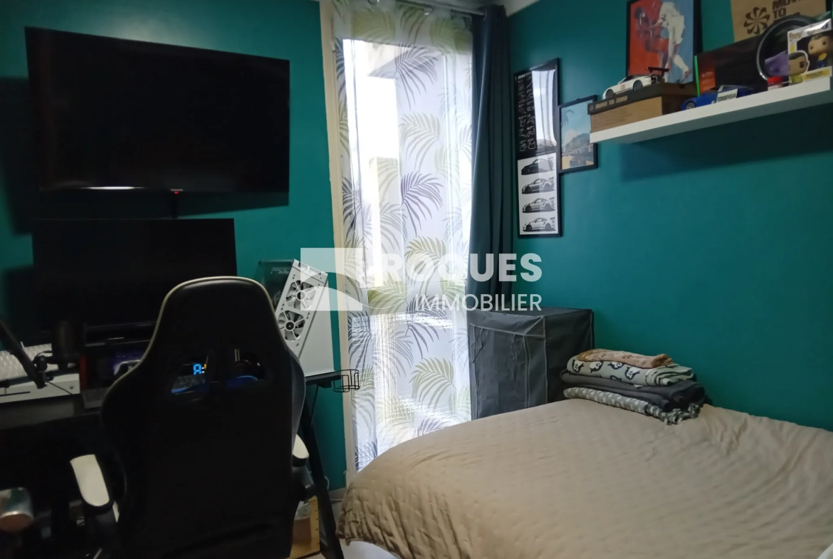 Bel appartement T4 à Millau avec balcon, cave et parking, proche des berges du Tarn 