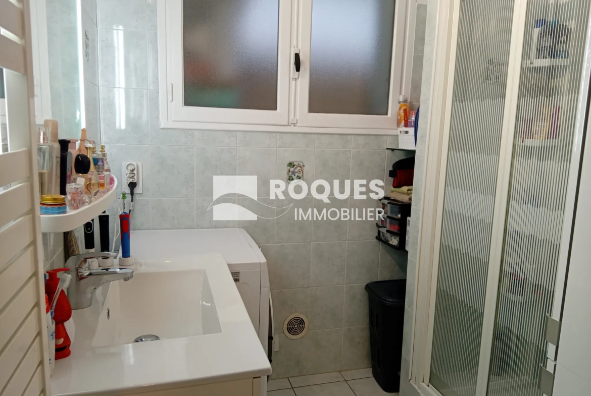 Bel appartement T4 à Millau avec balcon, cave et parking, proche des berges du Tarn 