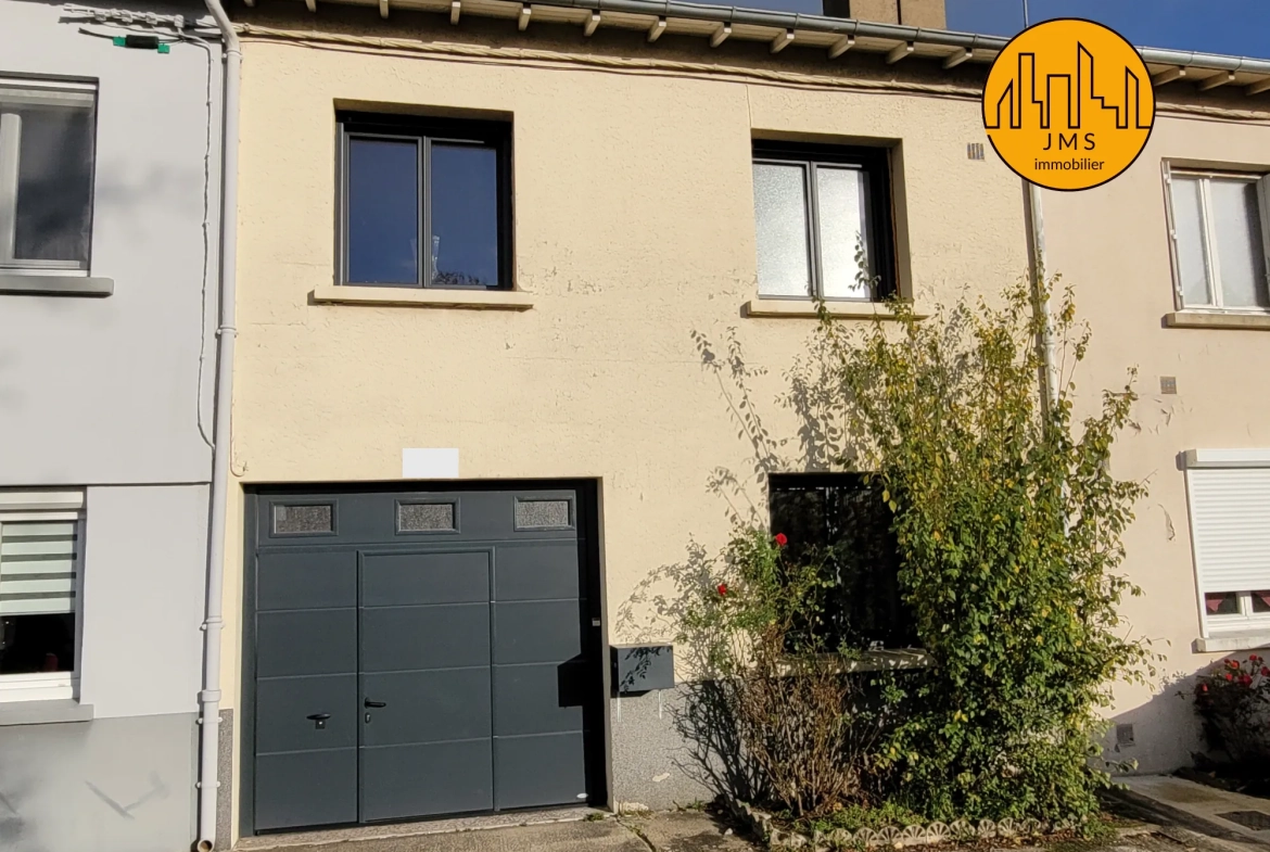 Maison mitoyenne à Yzeure avec jardin, garage et potentiel d'extension 