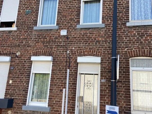 Maison en briques à Jeumont avec jardin et potentiel de rénovation
