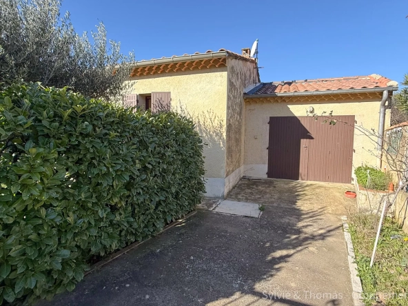 Maison de plain-pied à Orange - 80 m², 2 chambres, jardin, garage et véranda 