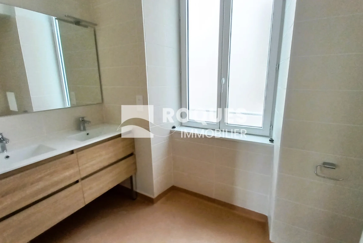 Appartement T3 rénové à Millau avec caves et galetas, situé près de la gare 
