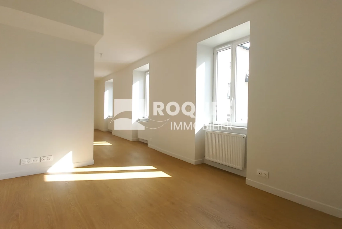 Appartement T3 rénové à Millau avec caves et galetas, situé près de la gare 