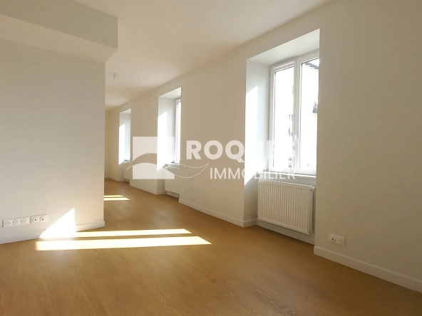 Appartement T3 rénové à Millau avec caves et galetas, situé près de la gare