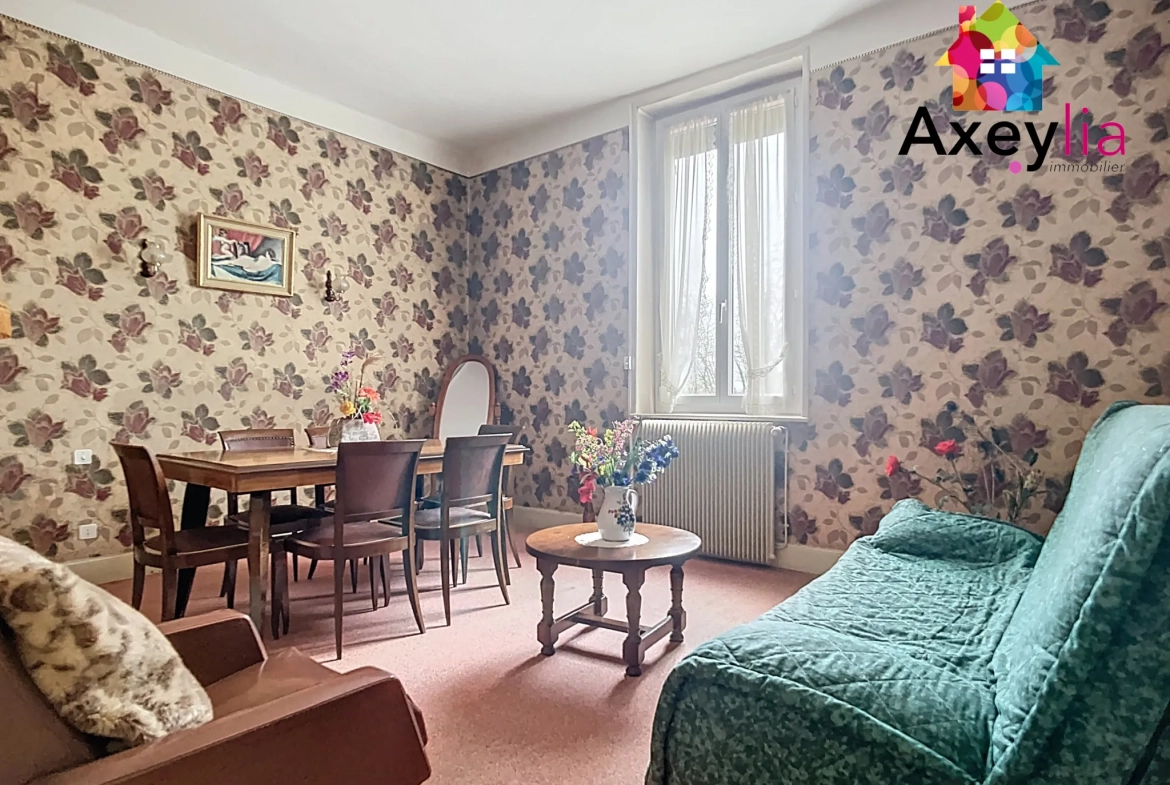 Maison à vendre à Roanne avec 2 chambres, garage et terrain clos de 312 m² 
