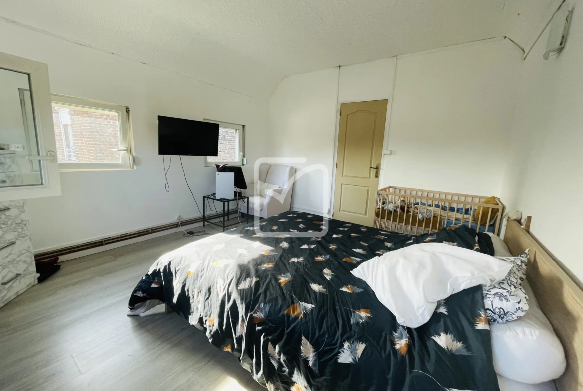 Maison semi-mitoyenne de 68 m² à Feignies avec terrain et stationnement 