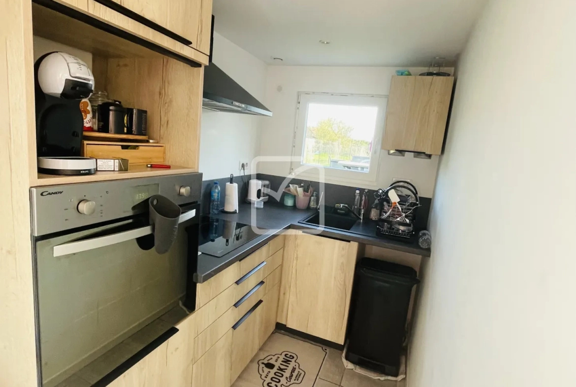 Maison semi-mitoyenne de 68 m² à Feignies avec terrain et stationnement 