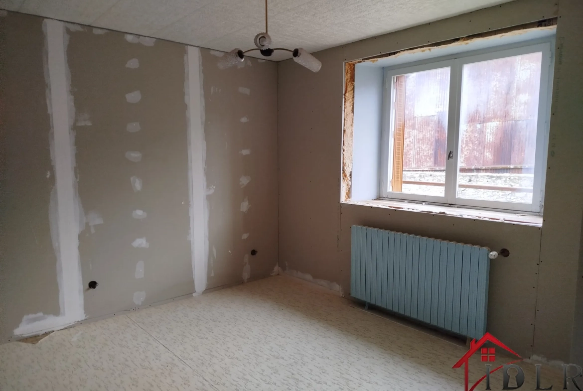 Maison en pierre à Bourdons-sur-Rognon (52700) avec garage et terrain 