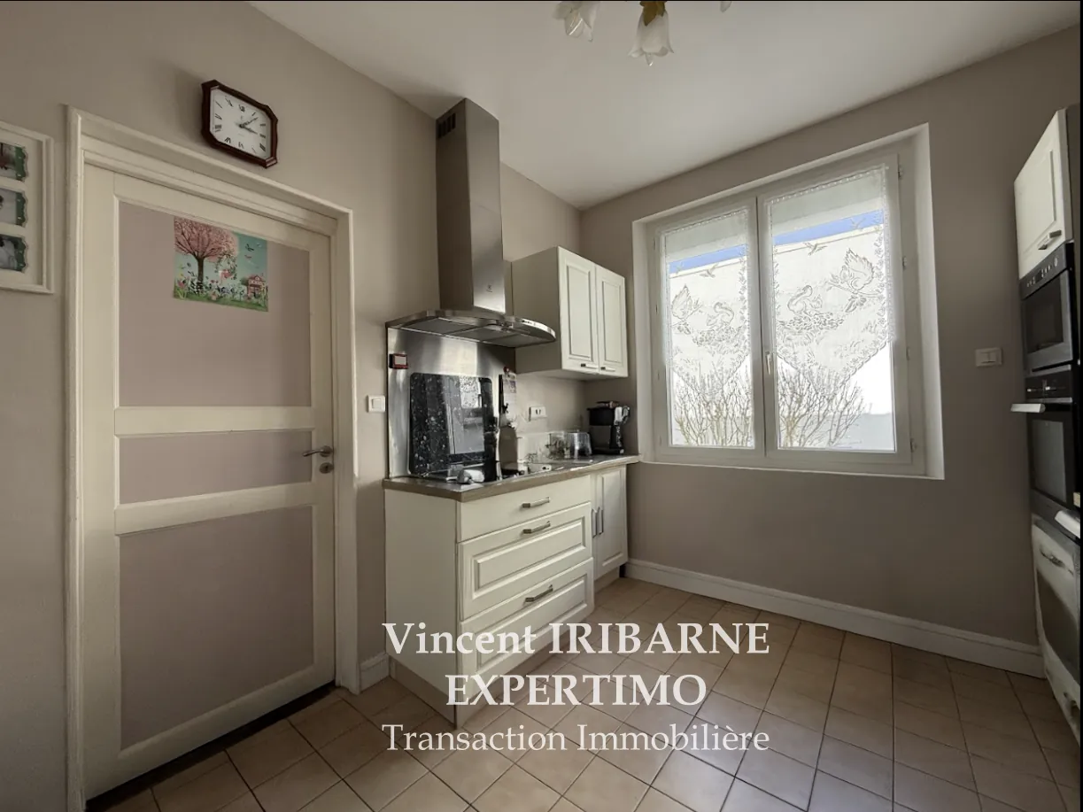 Maison de plain-pied avec jardin et garage à Saintes Rive Gauche 