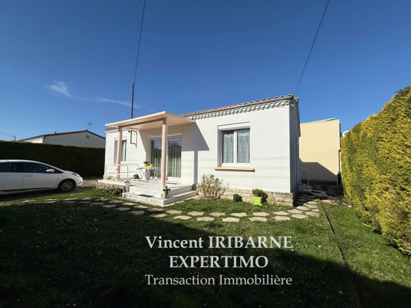 Maison de plain-pied avec jardin et garage à Saintes Rive Gauche