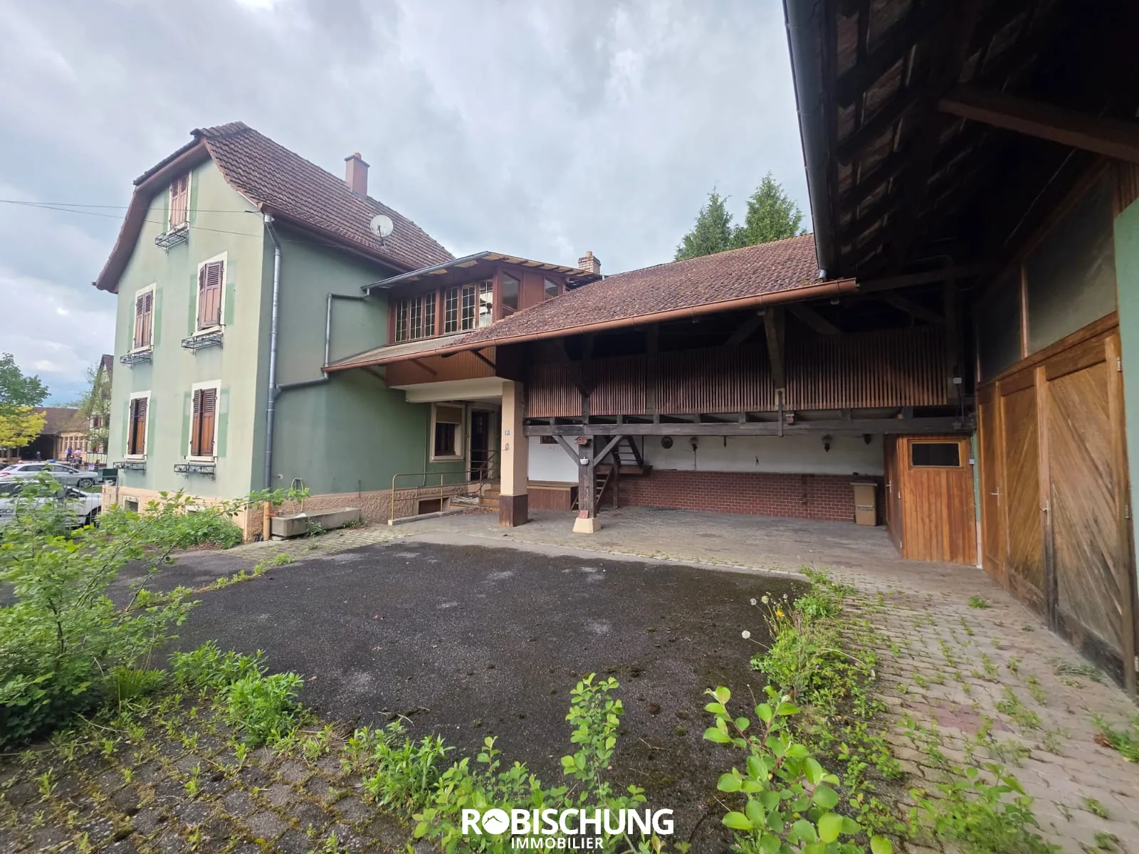 Corps de ferme à rénover à Hirtzbach en Alsace avec jardin et dépendance 
