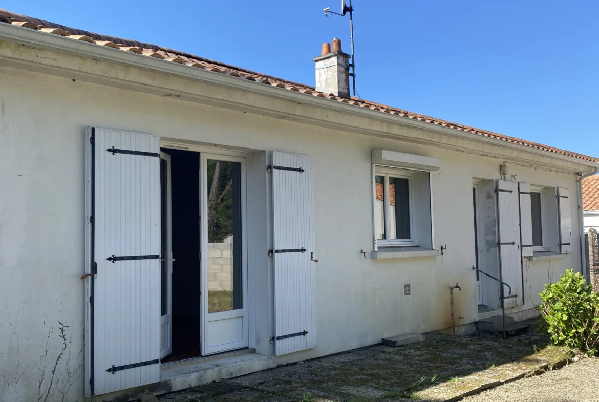 Maison 3 chambres avec garage à Challans, jardin et chauffage au fioul 