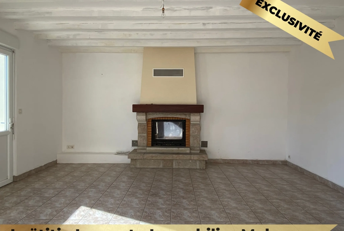 Maison familiale en pierre à Melesse avec grand volume et potentiel de rénovation 