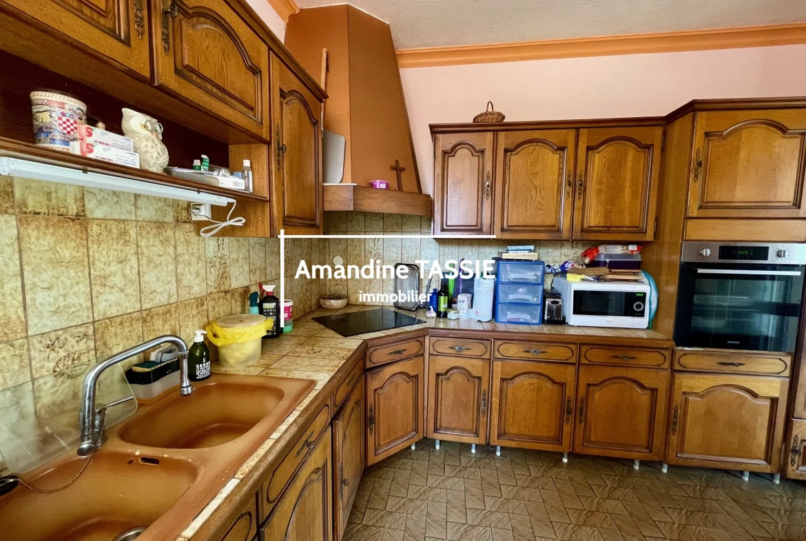 Maison individuelle lumineuse à Graulhet avec terrain constructible de 3450 m² 