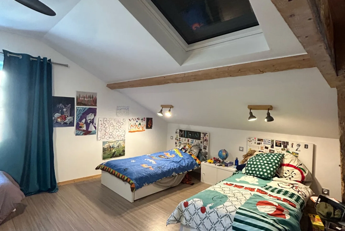 Maison individuelle à vendre à Romans-sur-Isère offrant confort et modernité 