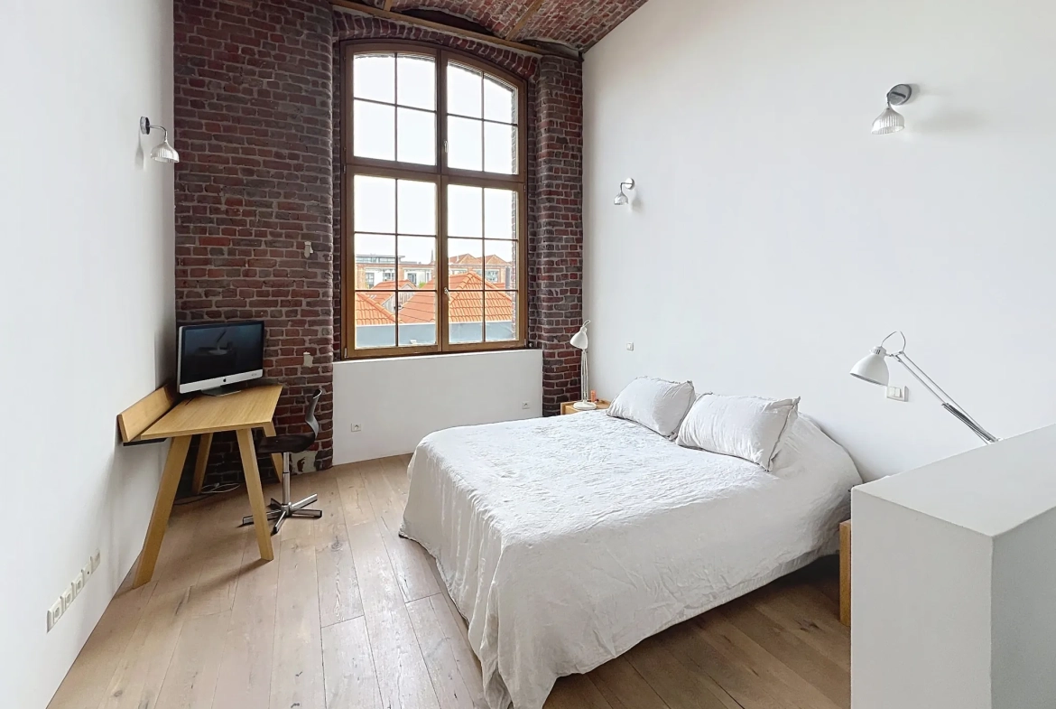 A vendre Loft spacieux de 150 m² à Tourcoing avec parking, cave et style industriel 