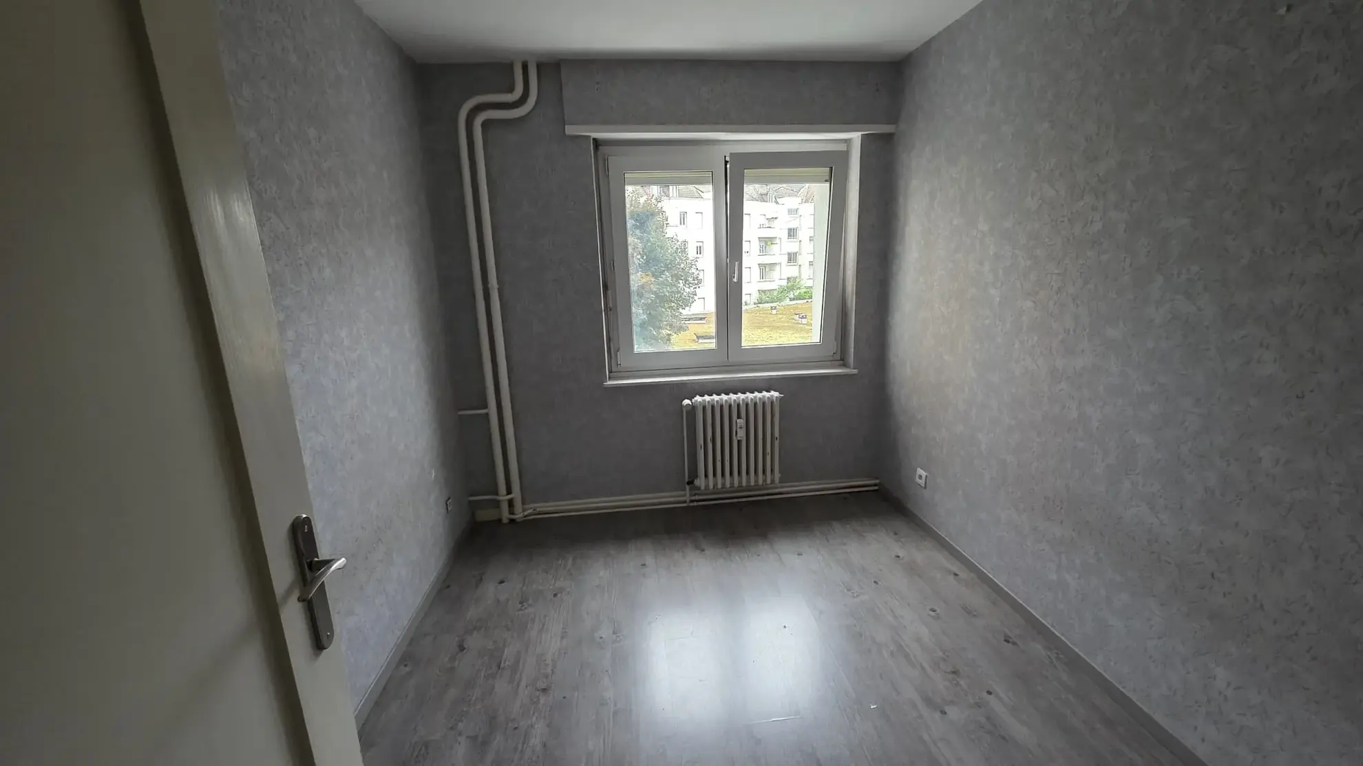 Appartement T4 à Mulhouse de 69 m² avec balcon, idéalement situé 