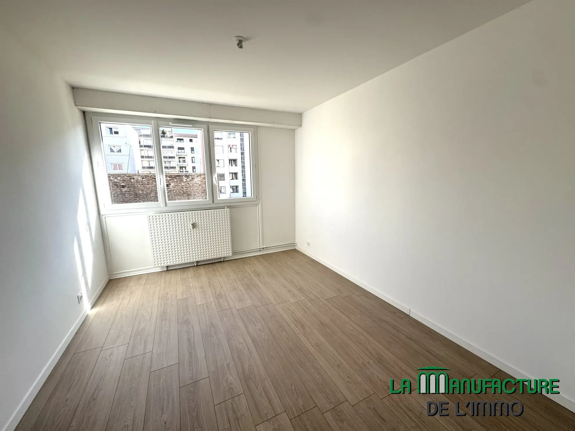 Appartement T3 rénové avec balcon, cave et garage à Saint-Étienne - Cité du design 