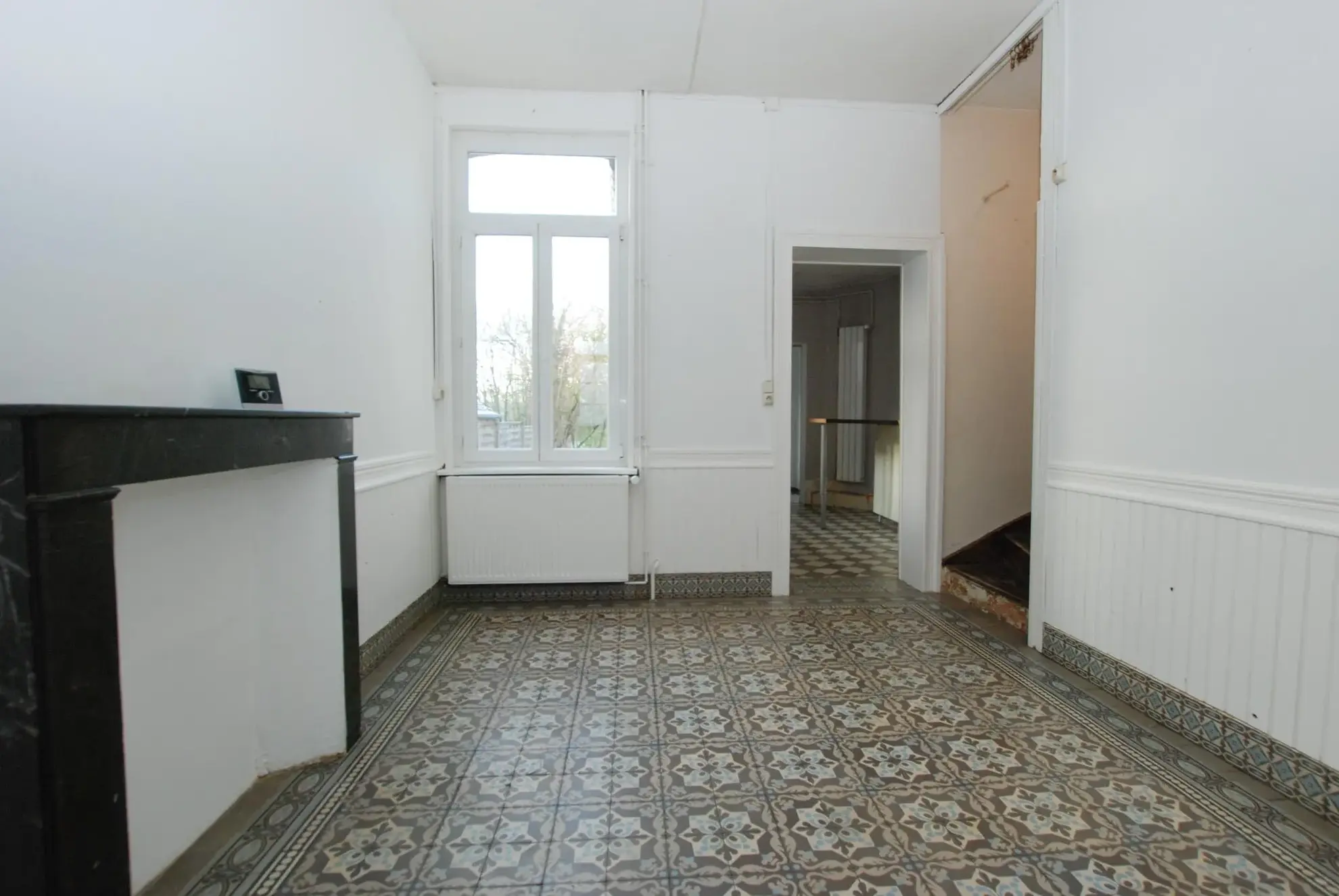 Belle maison semi-individuelle en brique à Jeumont avec 4 chambres, terrain clos et chauffage central au gaz 