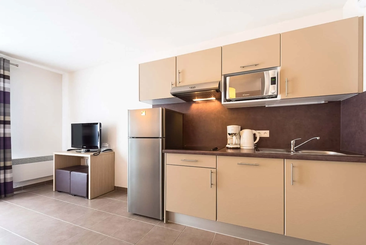 Investissement en bail commercial à Pont-Aven - Appartement de 26 m² avec terrasse et parking 