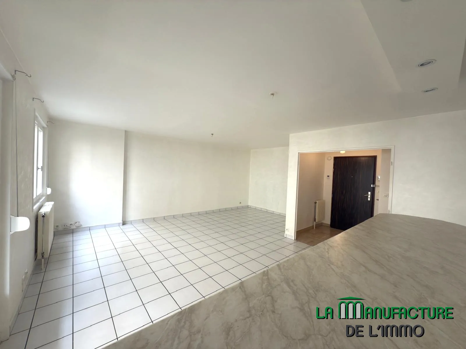 Appartement F2 bis avec balcon, cave et garage à Saint-Étienne 