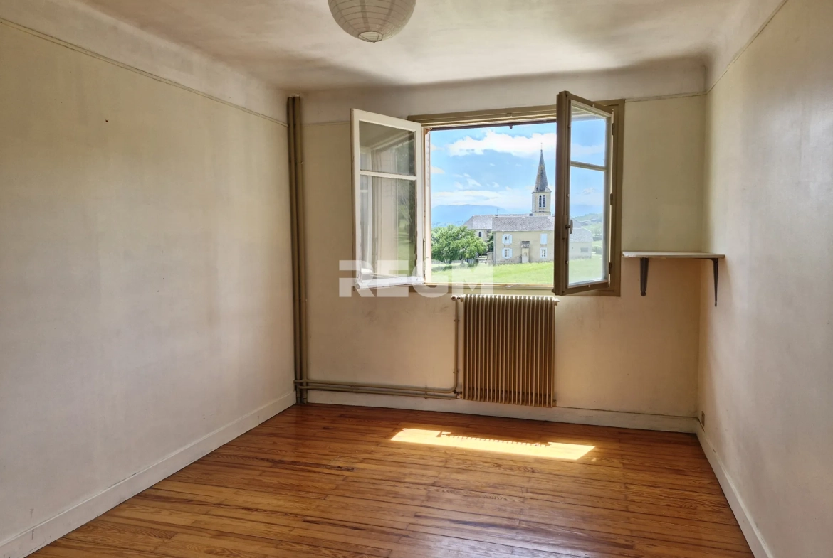 Maison à rénover proche de Tournay avec potentiel locatif et vue dégagée 