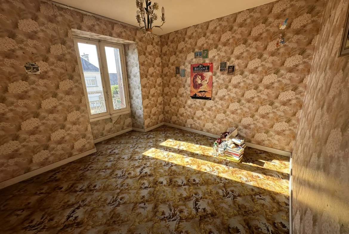 Immeuble à Baud avec grand potentiel d'aménagement et terrain de 558m² 