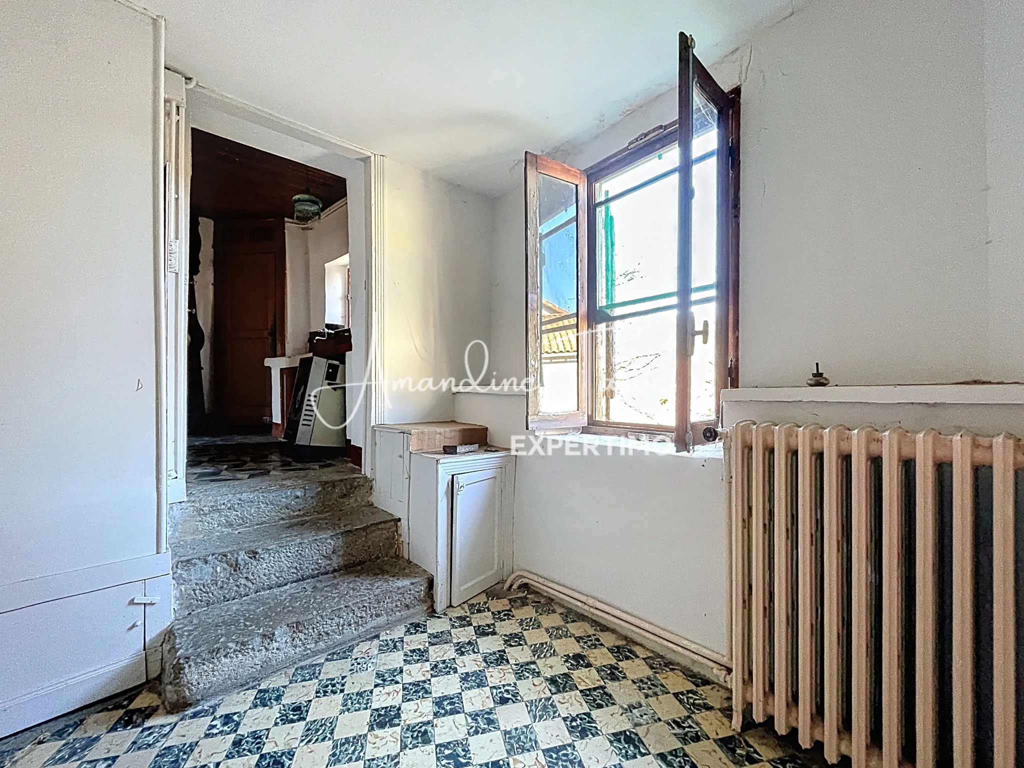 Maison de village à rénover avec garage et terrain à Labastide-Pradines 