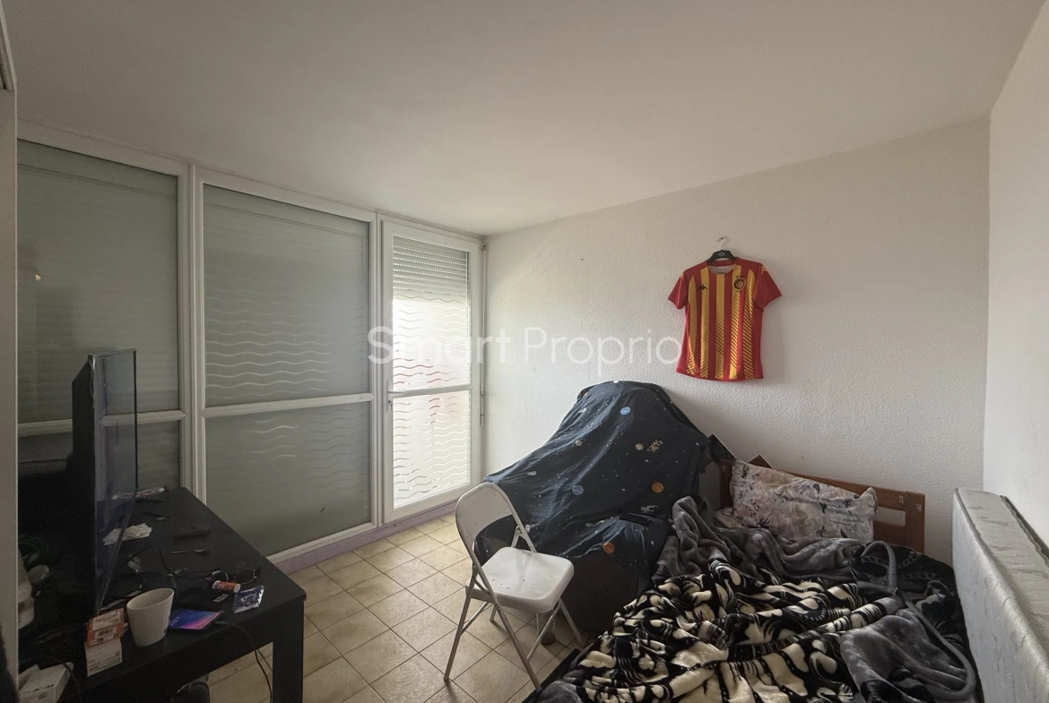 Appartement T4 à rénover à Carbon Blanc avec cave et parking 