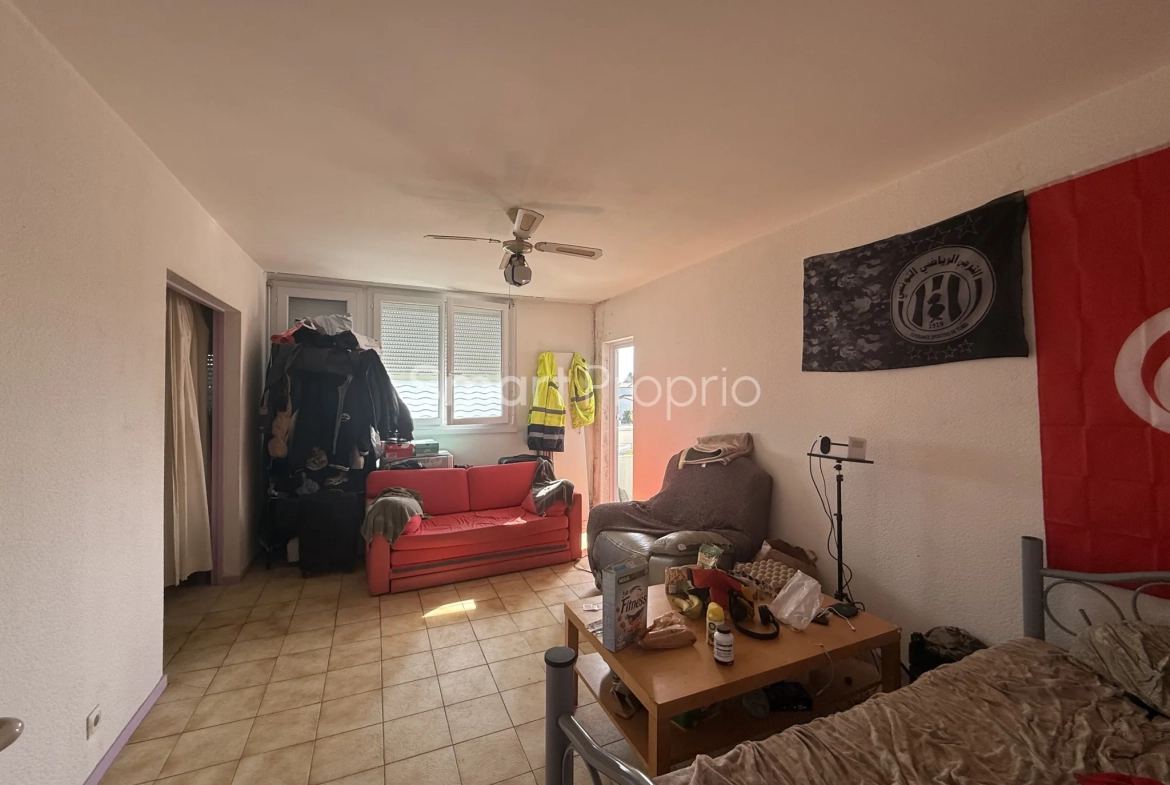 Appartement T4 à rénover à Carbon Blanc avec cave et parking 