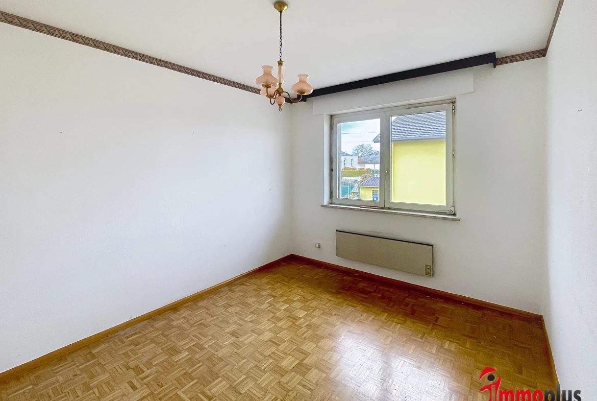 Maison plain-pied à Bollwiller avec grande pièce polyvalente et garage 