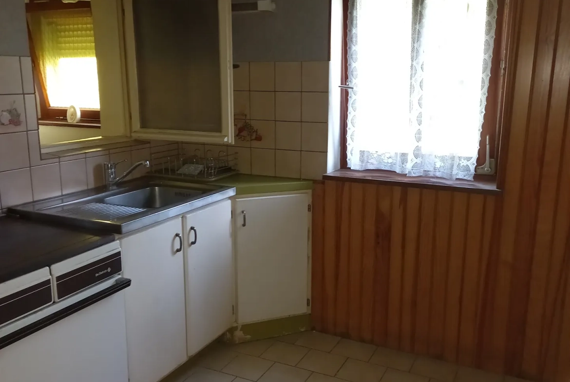Maison de 166 m² à Manspach avec double logement et dépendance 