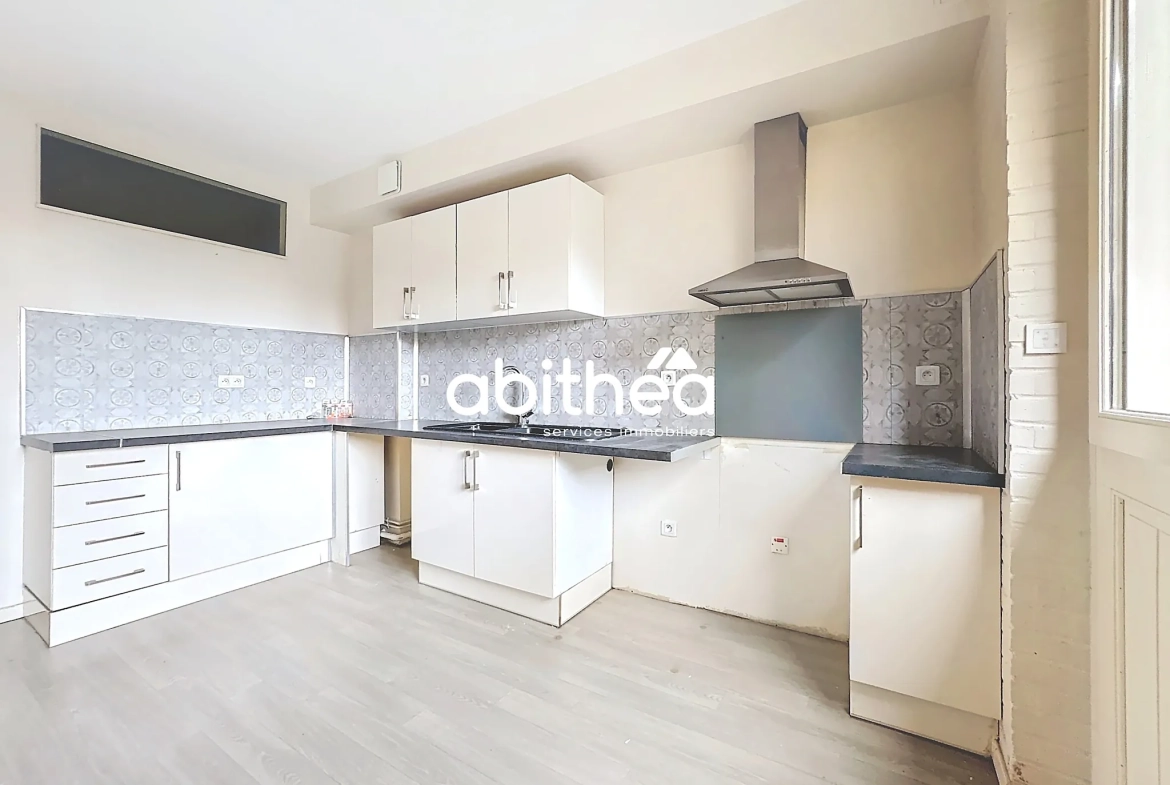 Appartement T4 en rez de jardin à Arras avec terrasse, cave et parking 
