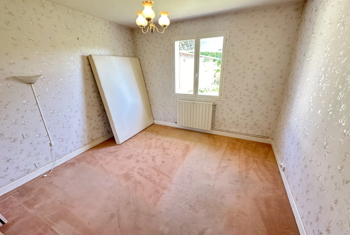Maison de plain-pied à Sainte-Bazeille avec jardin et garage 