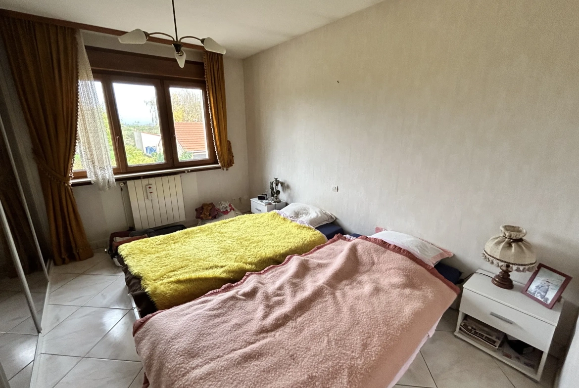 Maison lumineuse à vendre à Augny avec grand terrain et garage, proximité Metz 