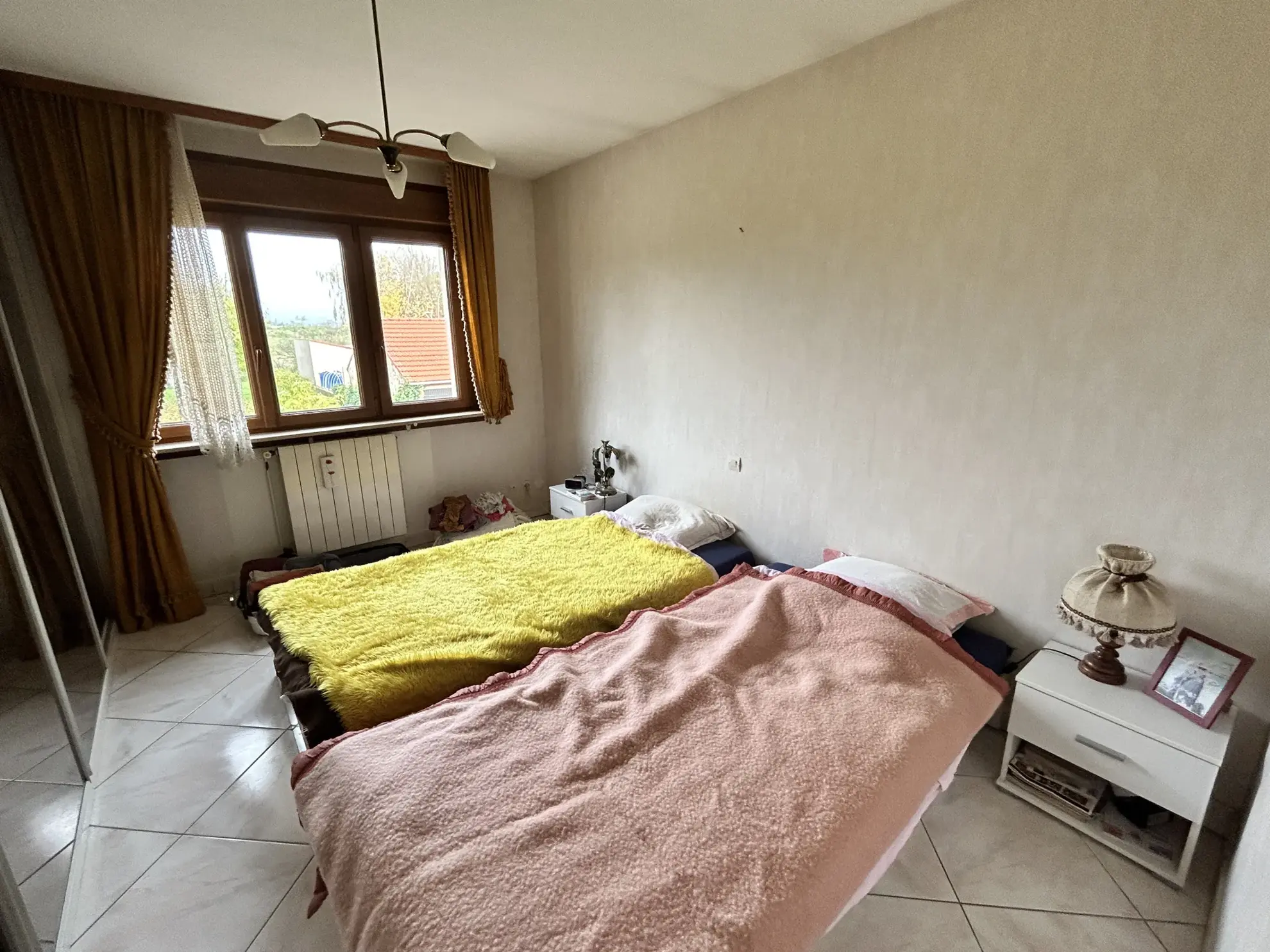 Maison lumineuse à vendre à Augny avec grand terrain et garage, proximité Metz 