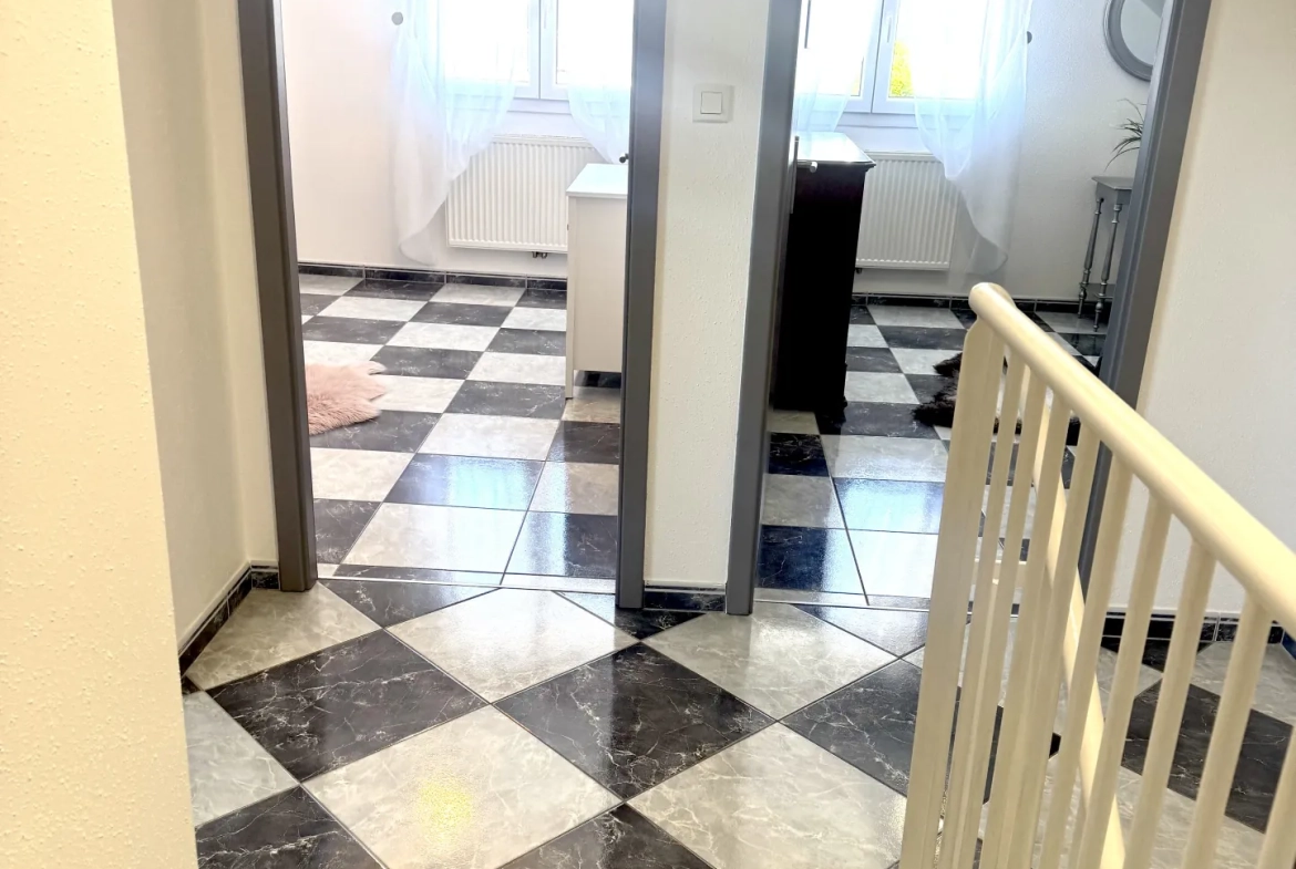 À vendre duplex à Bavilliers de 4 chambres avec terrasse et garage - secteur calme 