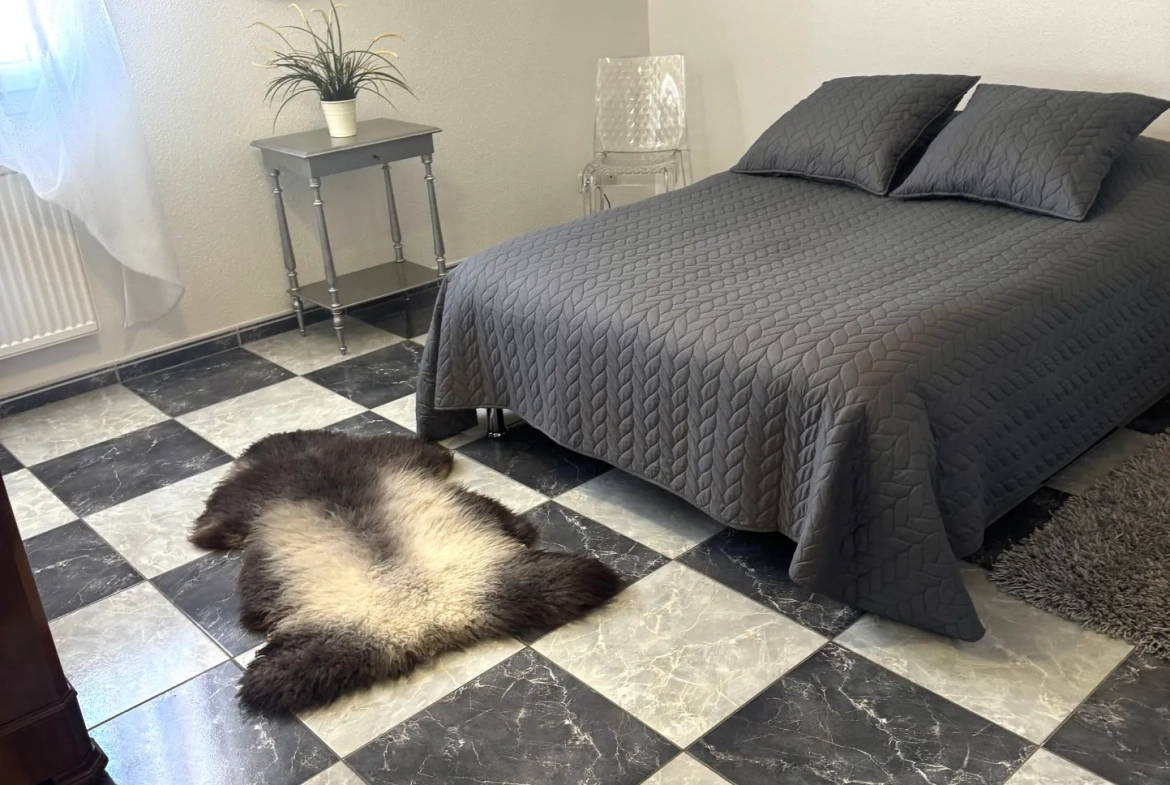 À vendre duplex à Bavilliers de 4 chambres avec terrasse et garage - secteur calme 