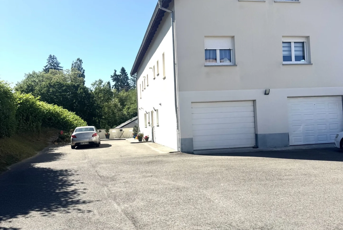 À vendre duplex à Bavilliers de 4 chambres avec terrasse et garage - secteur calme 