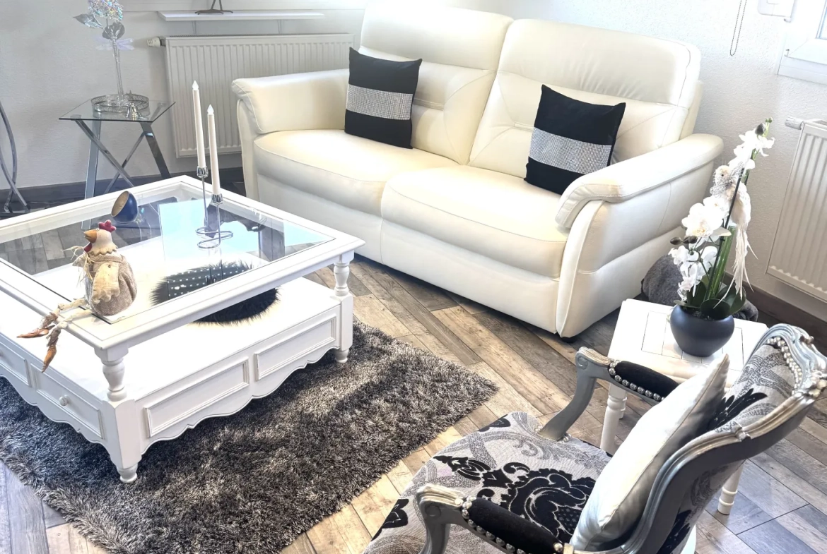 À vendre duplex à Bavilliers de 4 chambres avec terrasse et garage - secteur calme 