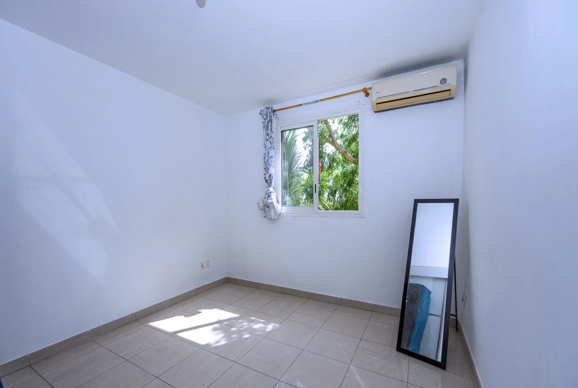 Appartement T2 avec varangue et parking à Sainte Clotilde - Résidence de 2013 